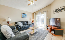 Living room overlooking the south-facing pool and spa area