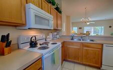 Full-size kitchen with all appliances, pots and pans