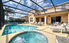 South-facing pool and spa with a lake and conservation view