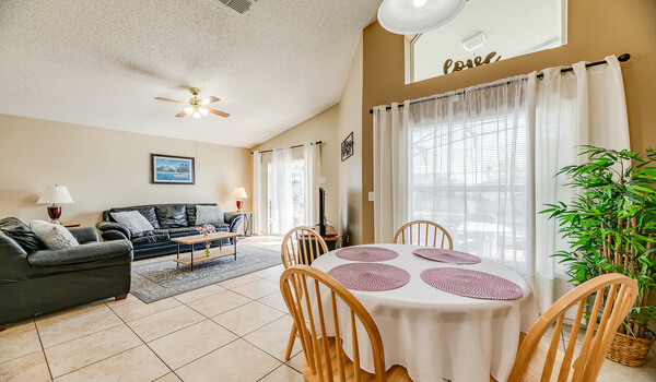 The breakfast table is located just next to the family living space