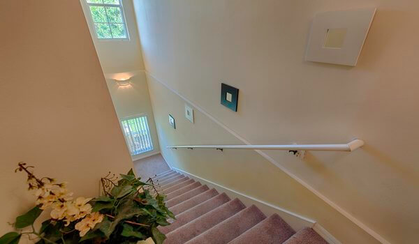 Stairs to the bedrooms and bathrooms