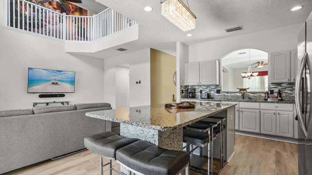Kitchen with huge sit-in granite dining area