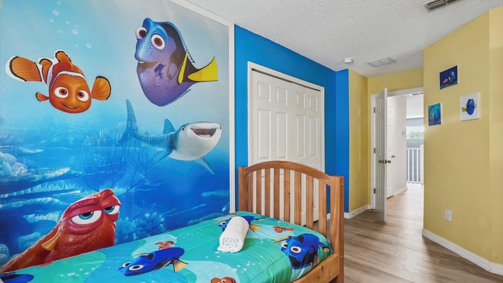 Bedroom #4: Dory themed bedroom with twin-twin bunk bed and a twin bed