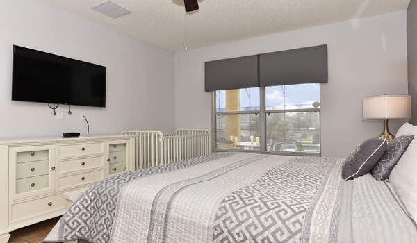 Relax in ths spacious bedroom and enjoy a movie on the 50" flat-screen Smart TV