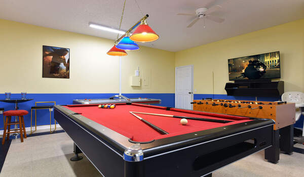 Pool table and air hockey table in the game room